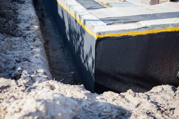 Professional Basement Waterproofing technician working in Walhalla, SC
